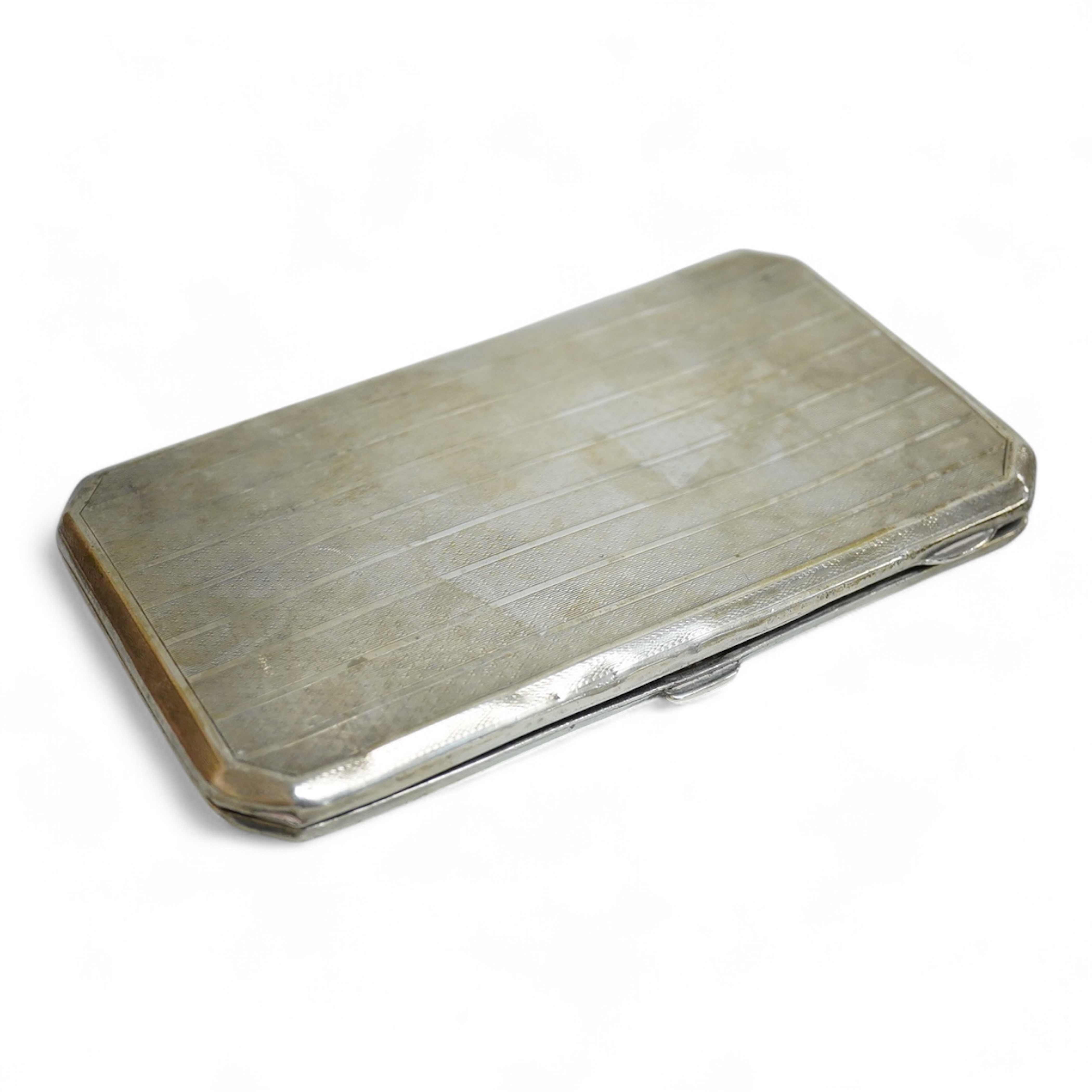 A George V silver rectangular cigarette case, with canted corners, Henry Matthews, Birmingham, 1926, 14.3cm, 6oz.